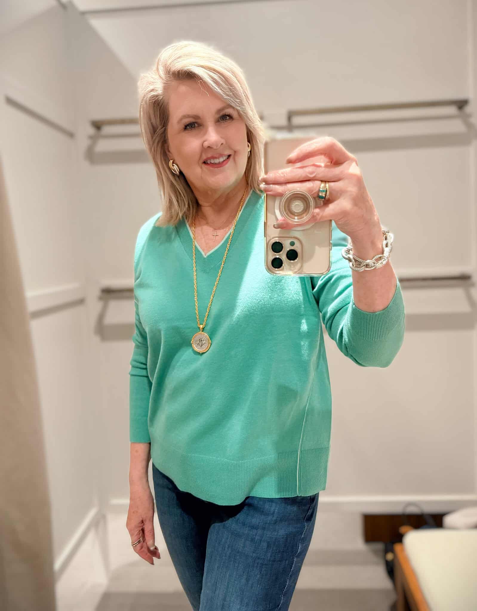 Tania wearing a green trimmed sweater from J.Jill