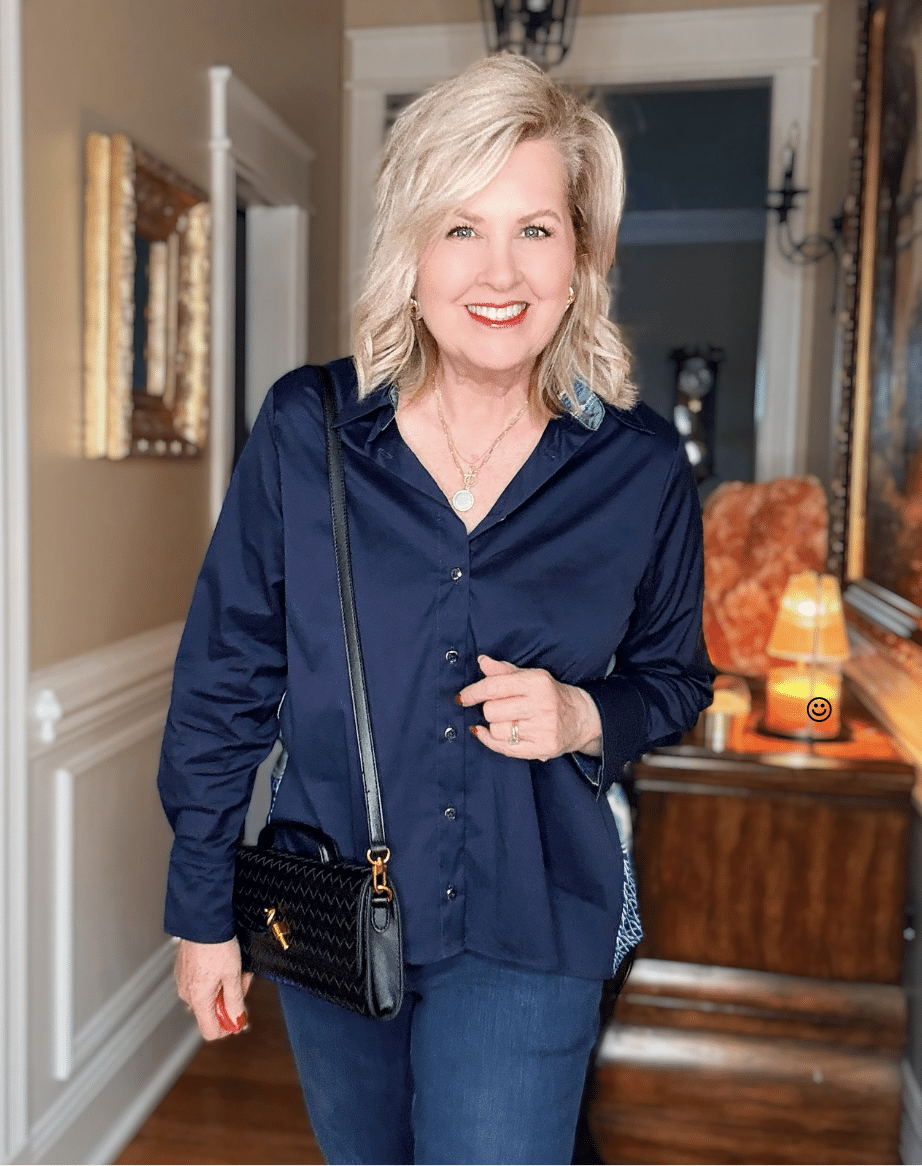 Tania wearing a navy top with faux silk twill pleated back from Chico's