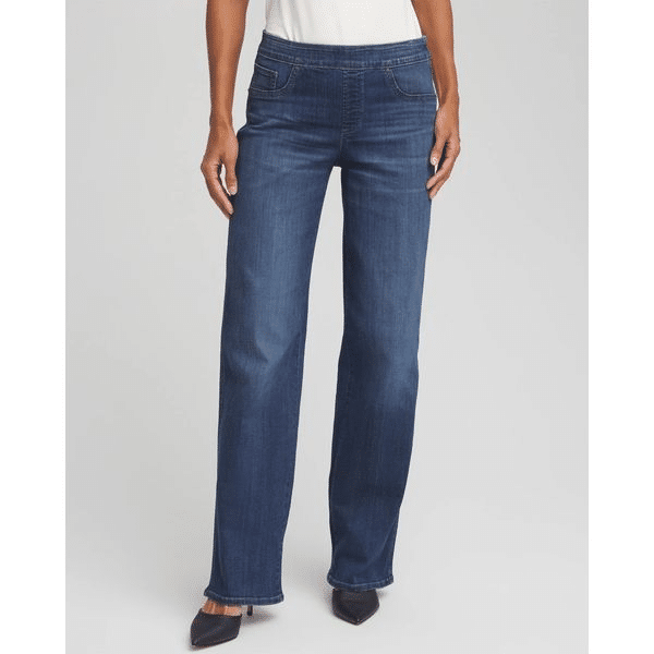 Woman wearing pull-on wide-leg jeans in a medium dark wash with a sleeveless top and black heels.