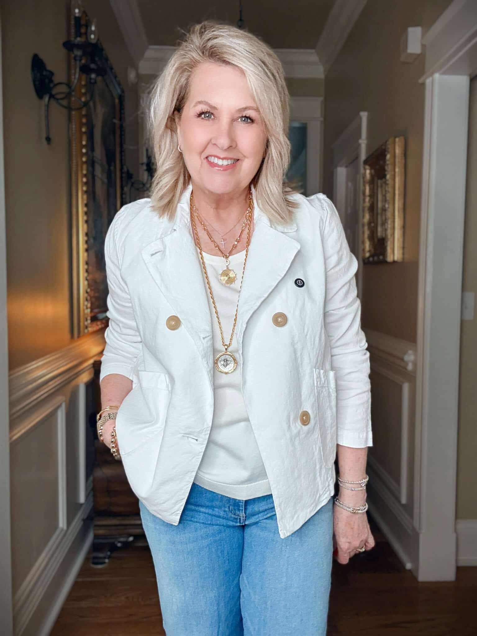 Tania wearing a linen white double breasted cropped peacoat from Frank & Eileen