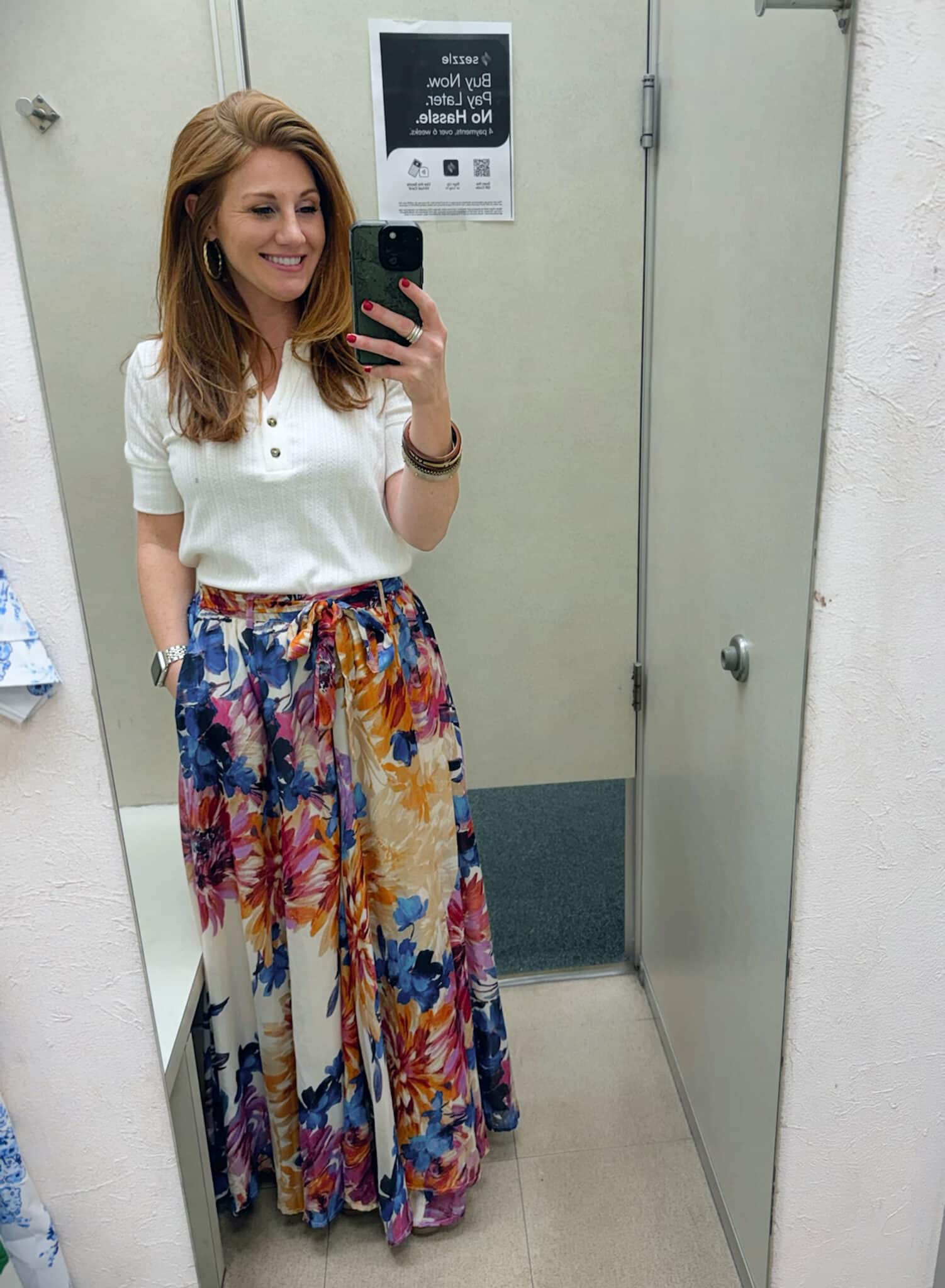 Stephanie wearing a TIE WAIST MULTICOLOR FLORAL MAXI SKIRT and a white tee