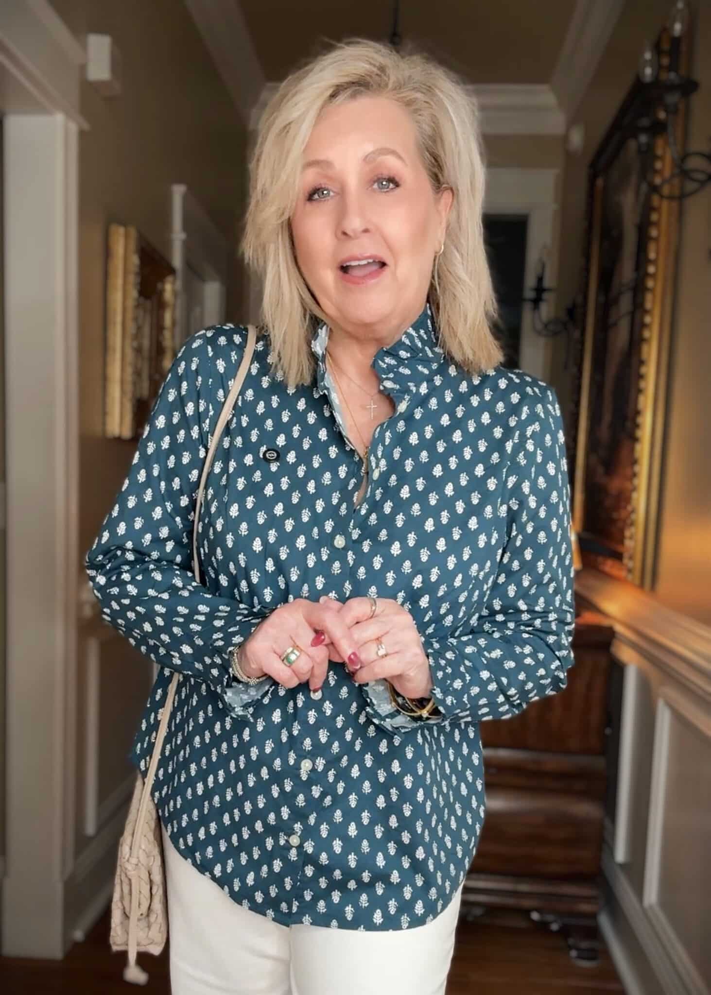 Tania wearing a teal and white shirt from J.Crew Factory