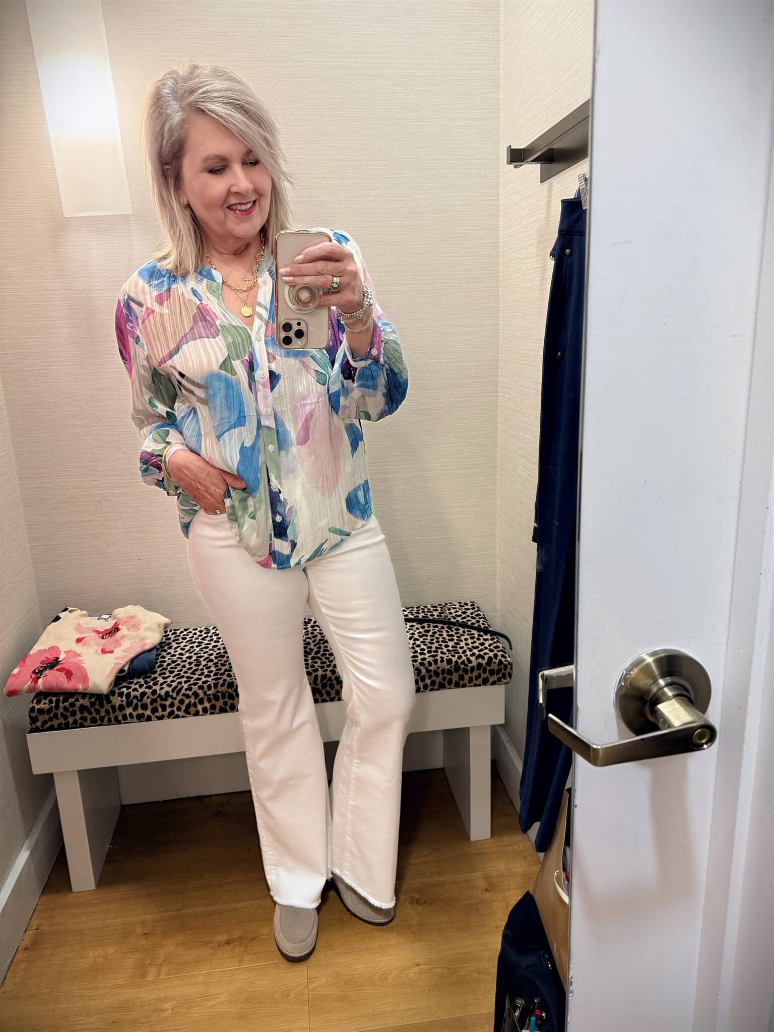 Tania wearing a colorful blouse with white jeans from Chico's New Arrivals