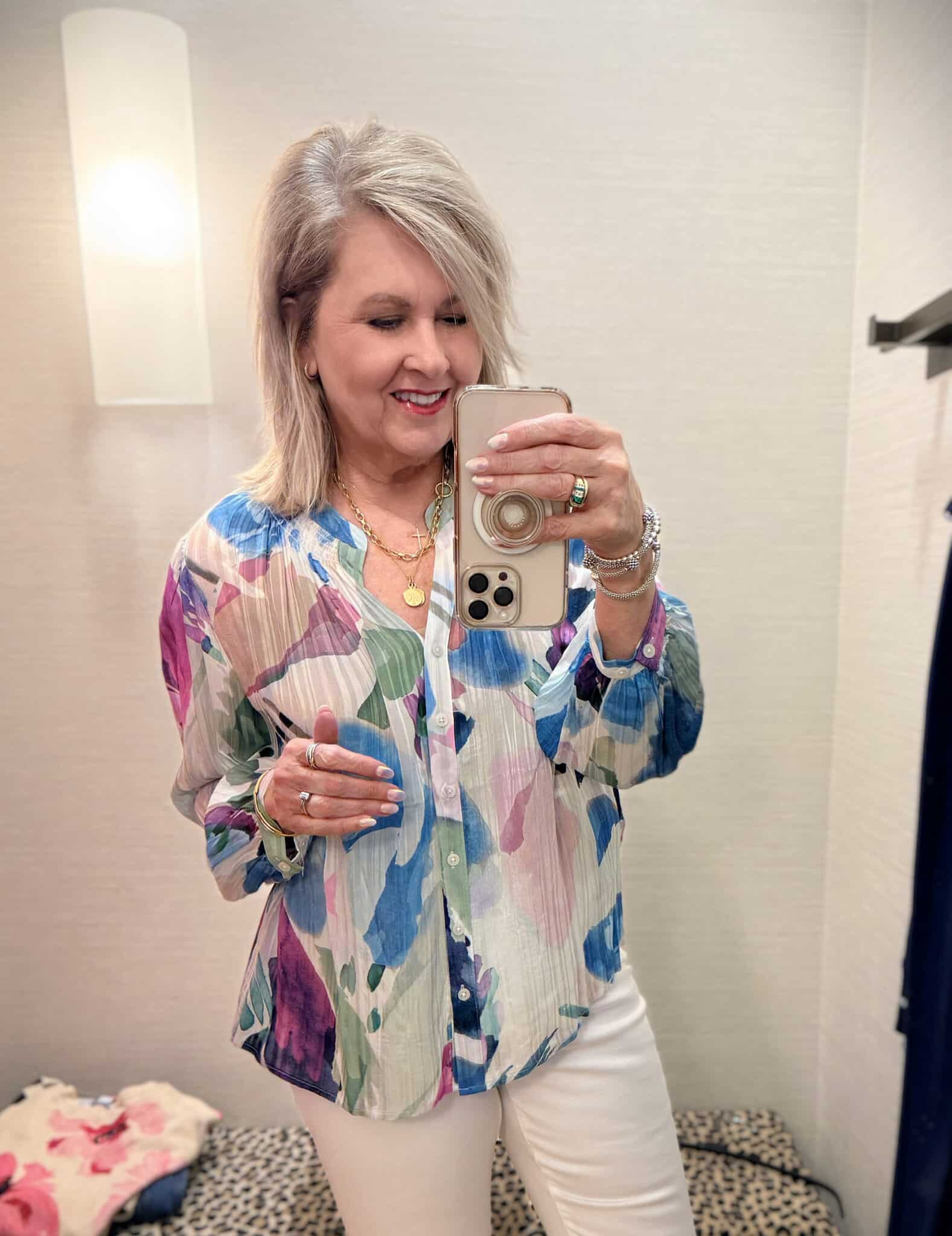 Tania wearing a colorful blouse from Chico's.