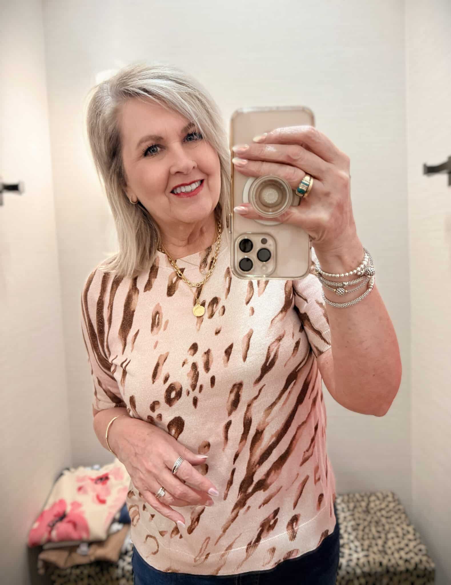 Tania wearing a beige metallic sweater from Chico's new arrivals