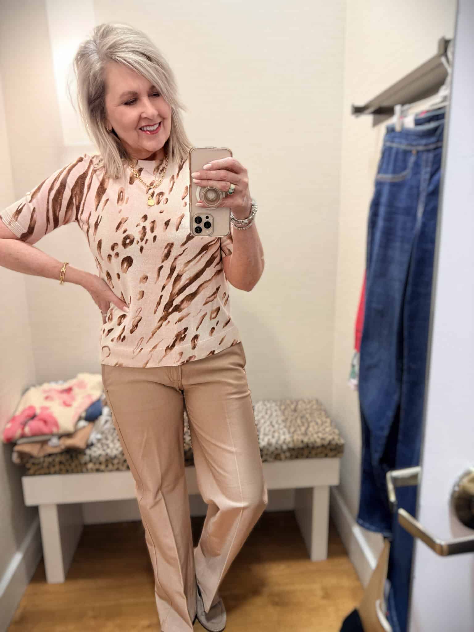 Tania wearing a beige metallic sweater with beige pants from Chico's new arrivals