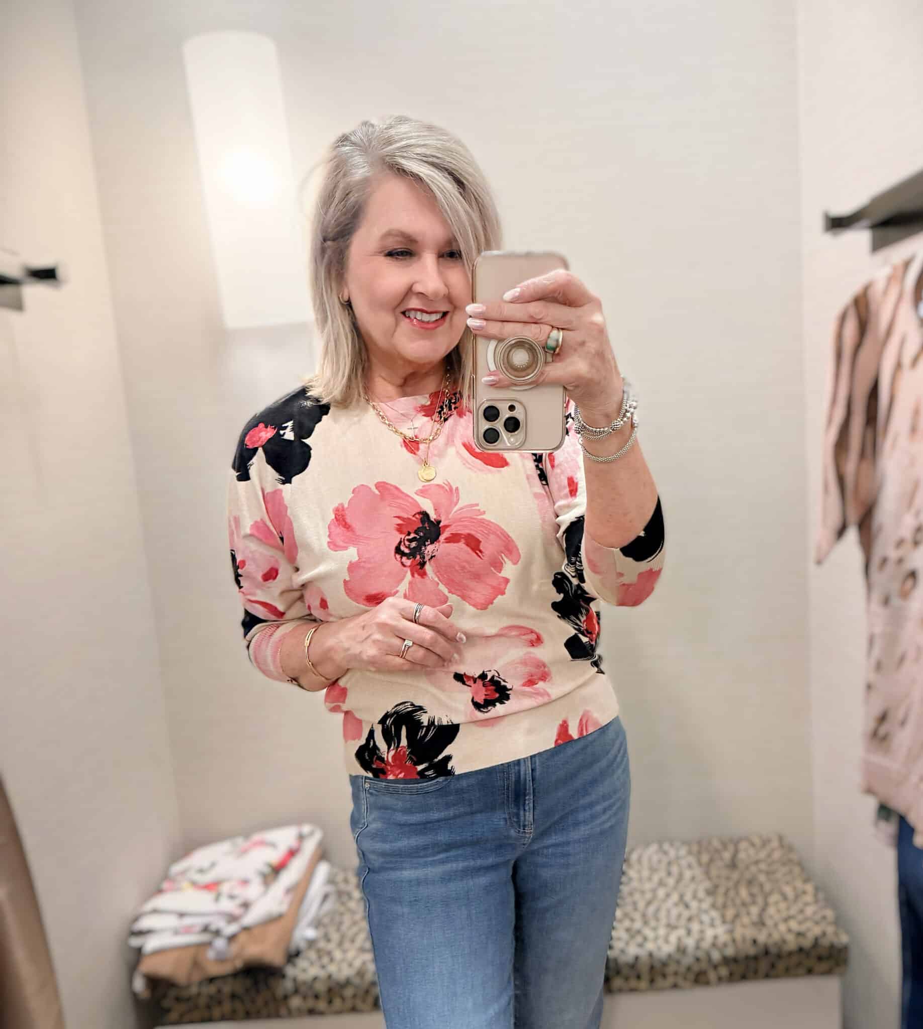 Tania wearing a floral sweater from Chico's