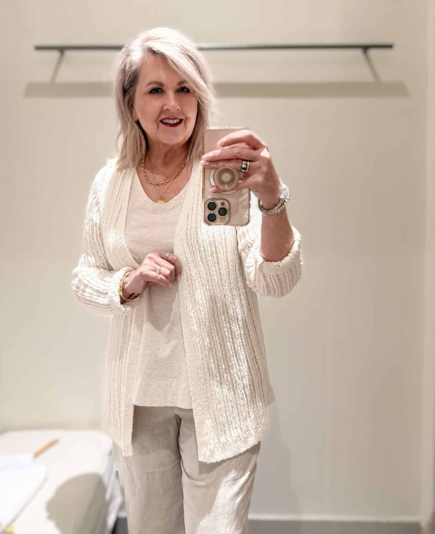 Tania wearing a cream colored cardigan over a layering tank from J.Jill