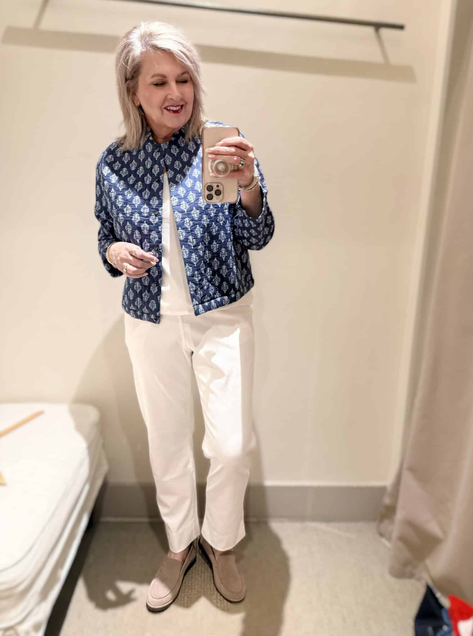 Tania wearing a blue and white printed jacket and white pull on pants from J.Jill