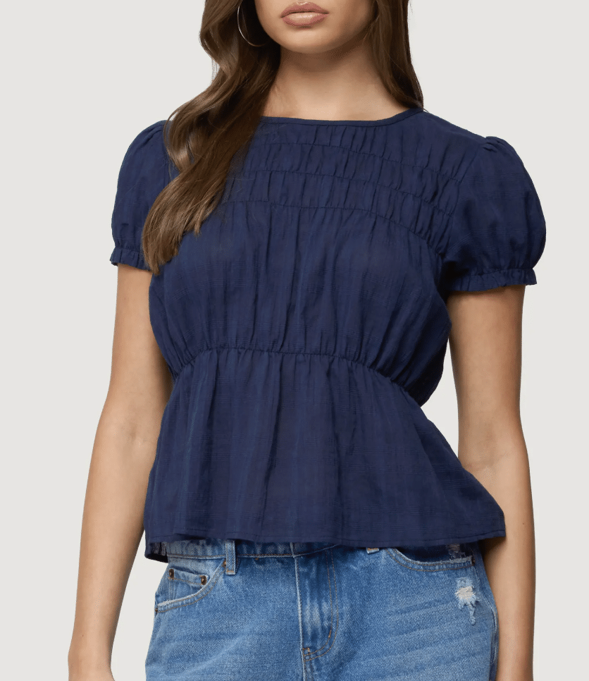 Peplum puff sleeve top with defined waist and soft structure