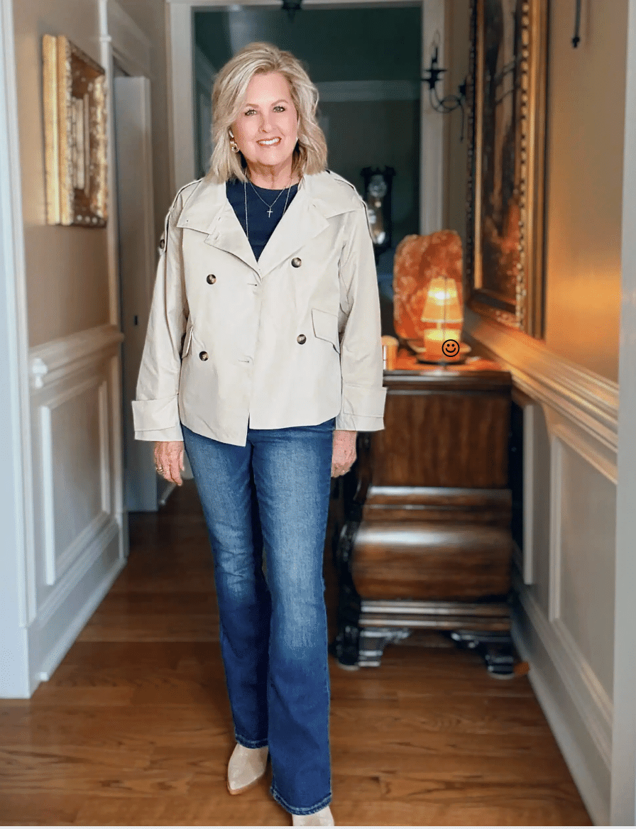 Tania wearing a navy tee and jeans with a light weight cropped trench jacket from Amazon
