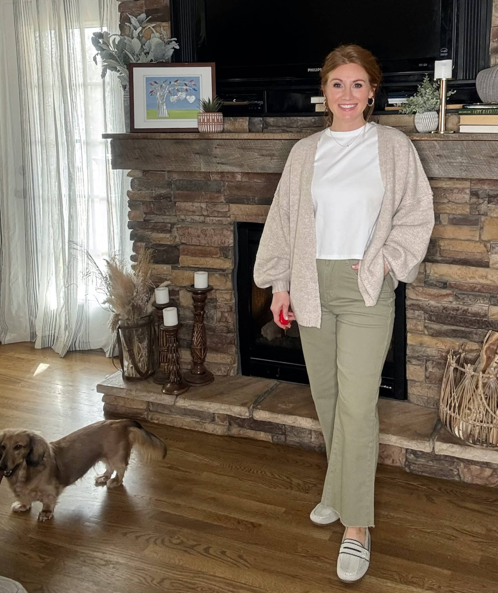 Neutral oversized cardigan outfit with loafers and ankle jeans