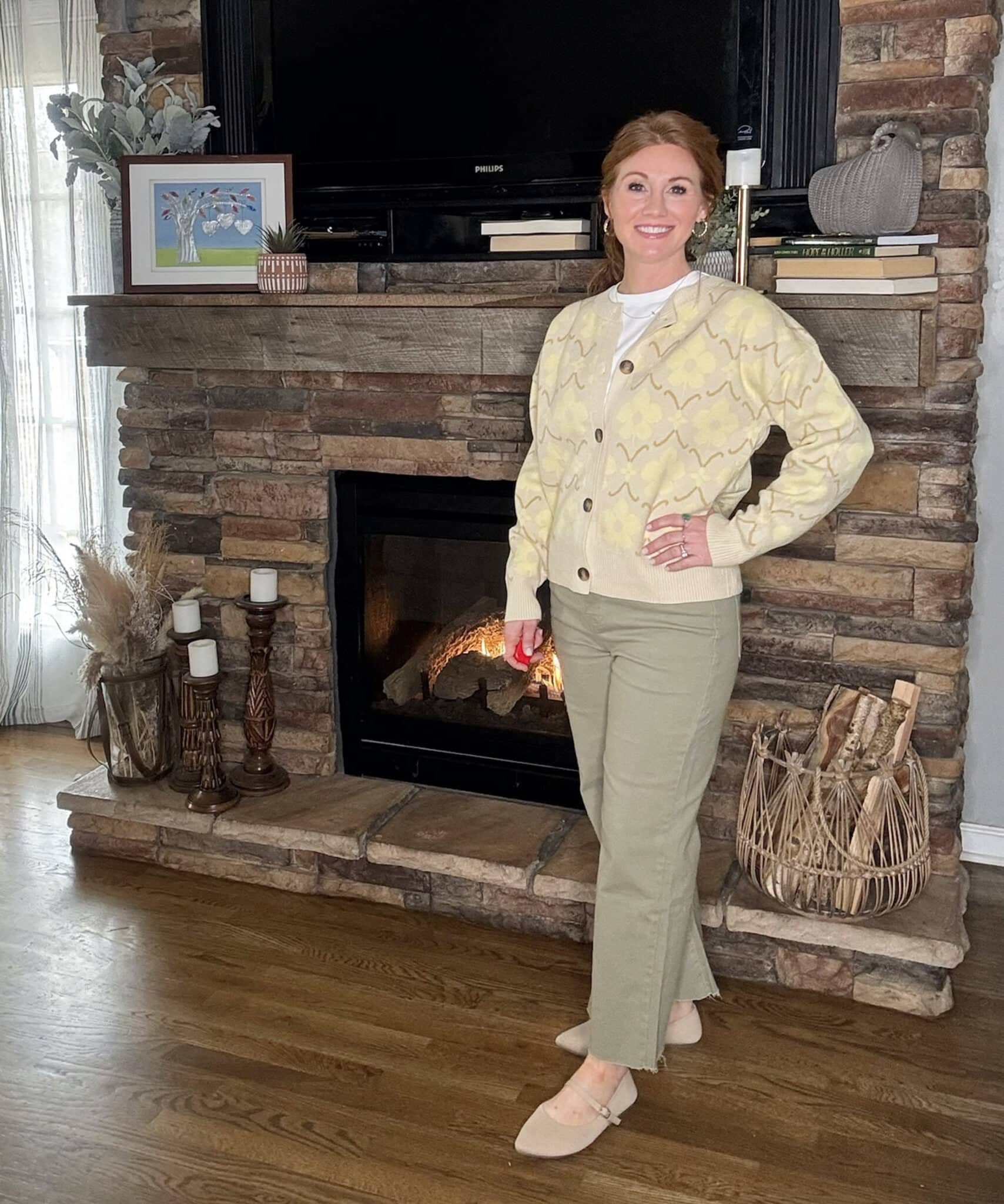 Floral cardigan layered over ribbed top with ankle wide leg jeans