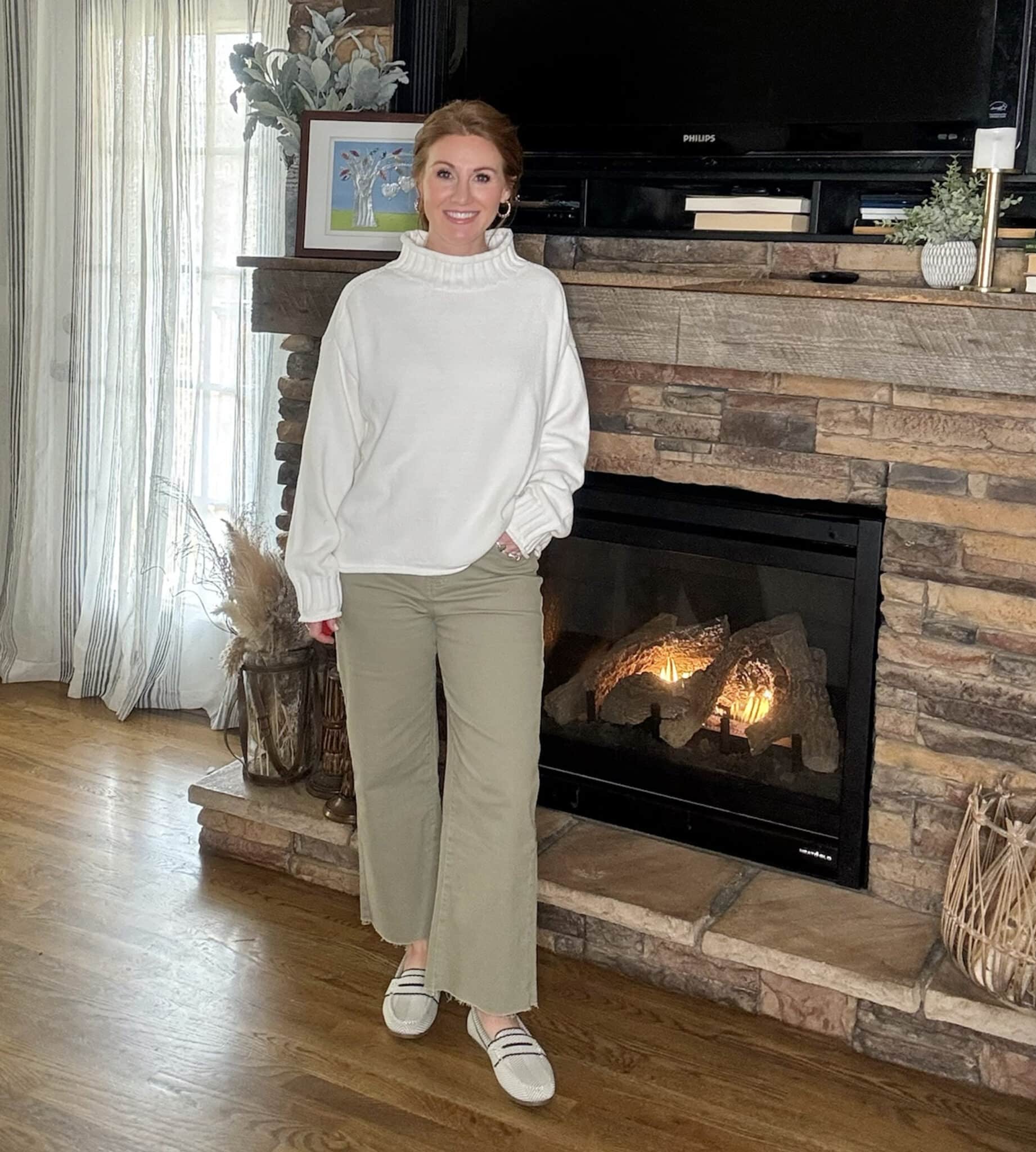 Cozy oversized rollneck sweater styled with casual wide leg jeans