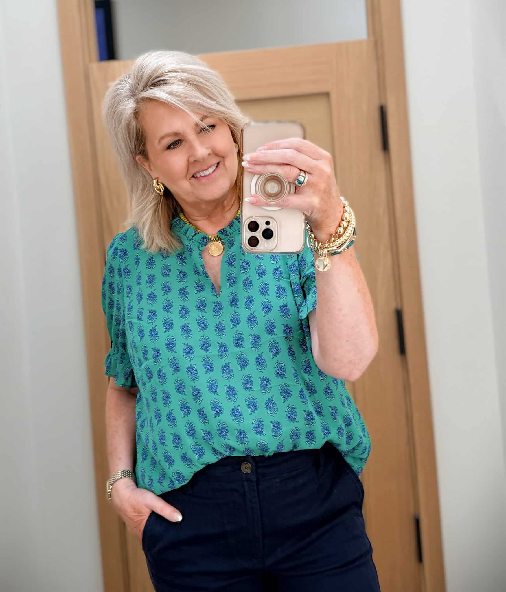 Tania wearing a green printed top from J.Crew Factory