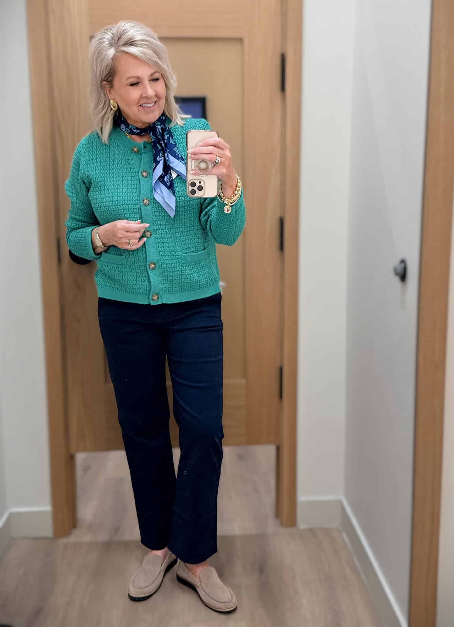 Tania wearing a green cardigan with dark chinos and a scarf from J.Crew Factory