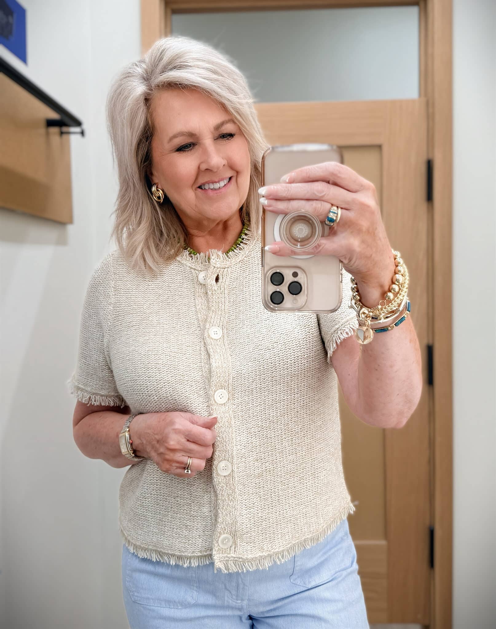 Tania wearing a beige fringed cardigan rom J.Crew Factory