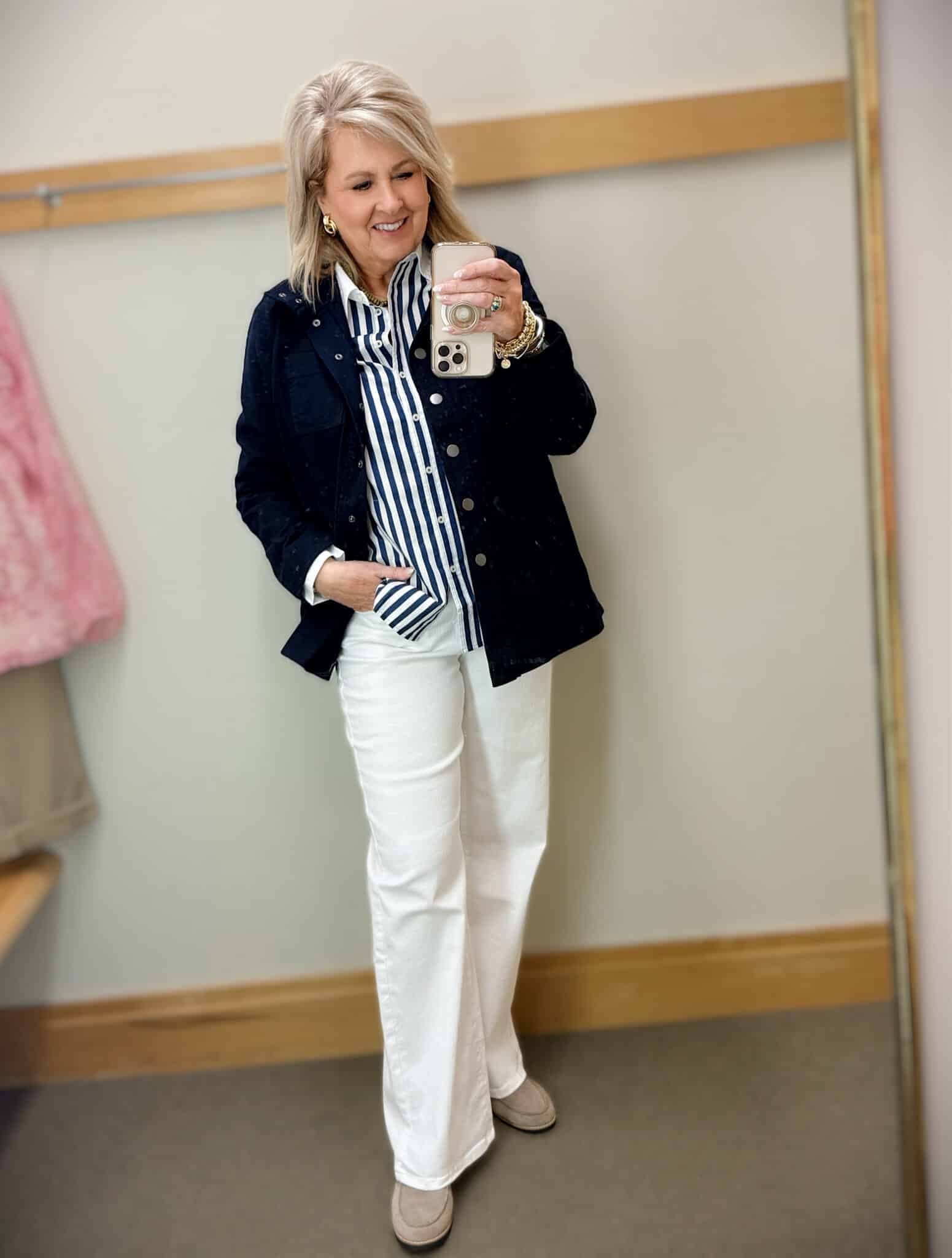 Tania wearing a striped shirt with a navy jacket and white jeans from Talbots