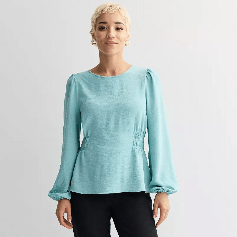 Cinched long sleeve blouse with tailored shape paired with slim pants for an elegant day-to-night outfit