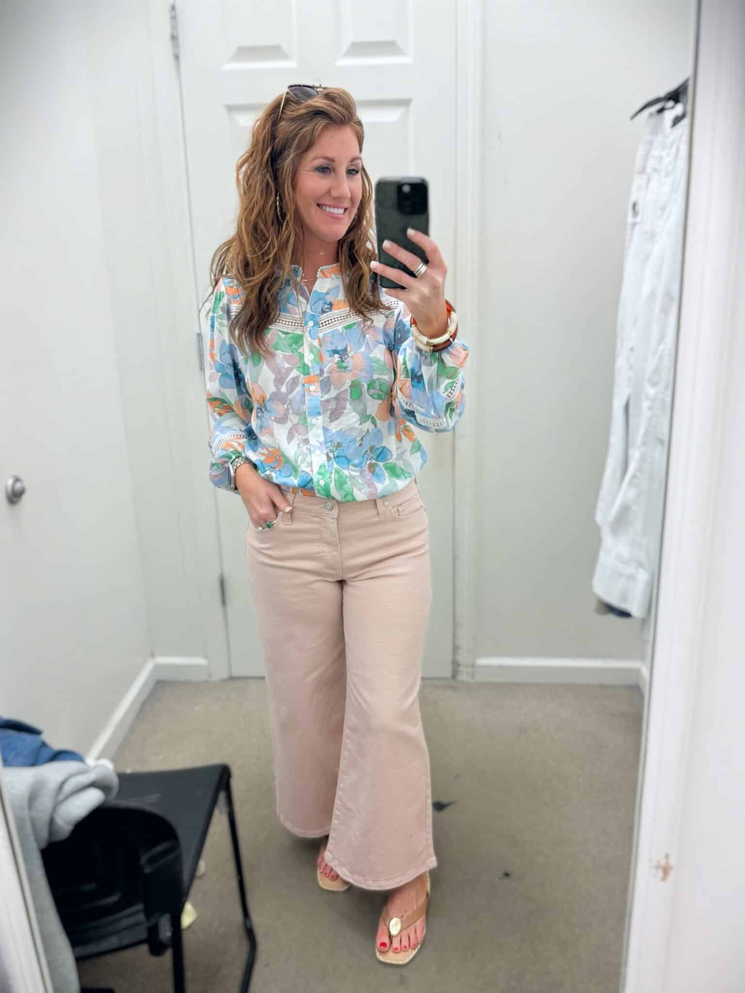 Stephanie styling a colorful button up top and colored jeans for petites from Belk