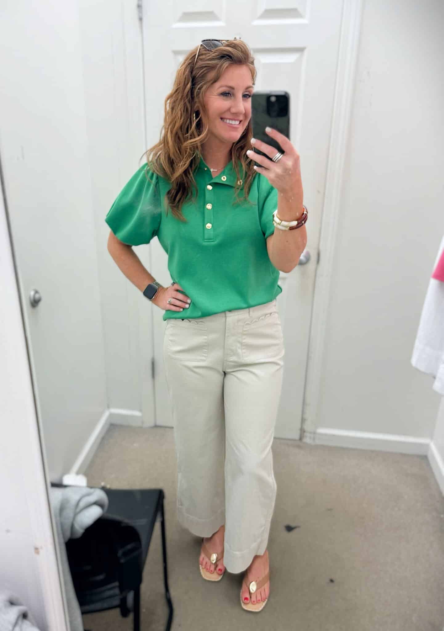 Stephanie styling a puff sleeve green top and gray scalloped jeans for petites from Belk
